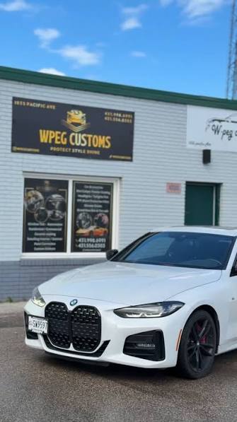 How Window Tint Protects Your Car During Winnipeg Summers: Heat, UV & Interior Protection Guide White BMW 4 Series with professional window tint parked outside WPEG Customs window tint shop in Winnipeg during summer